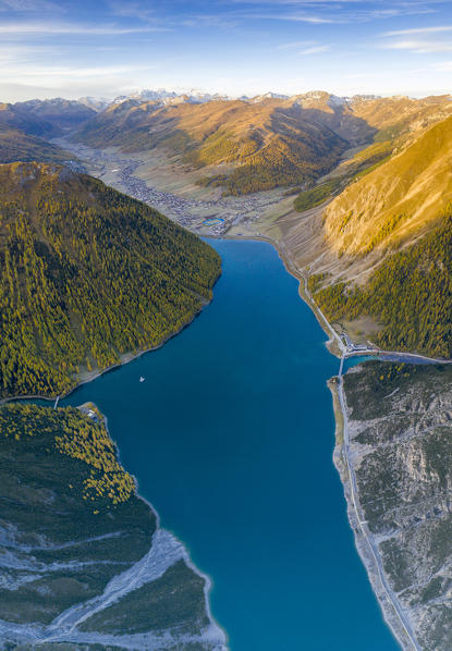 Aerial panoramic of lake and colorful woods in autumn, Livigno, Sondrio province, Valtellina, Lombardy, Italy