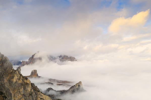 Cinque Torri and Tofane mountains in a sea of clouds during autumn, aerial view, Giau Pass, Dolomites, Belluno, Veneto, Italy