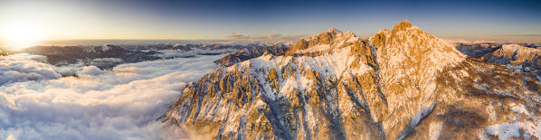 Sunset over Grigne group in a sea of clouds, aerial view, Lake Como, Lecco province, Lombardy, Italy