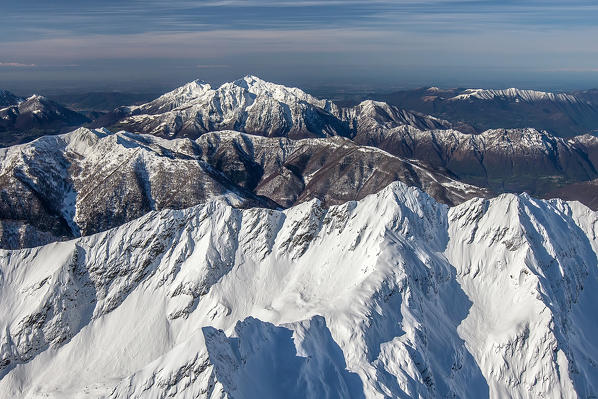 Aerial shot of snowy peaks in the Orobie Alps Val Lesina and the Grigne group Valtellina, Lombardy Italy Europe