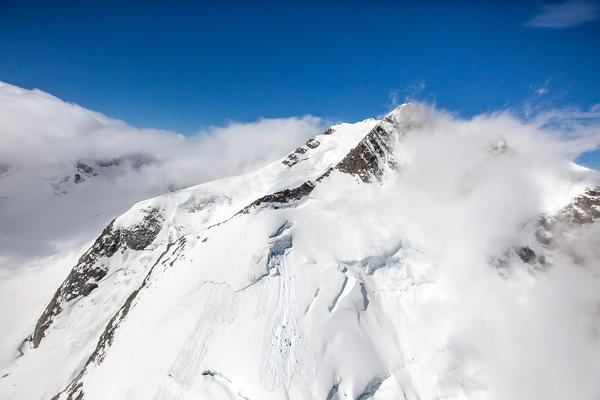 Aerial view of Pizzo Bernina covered with fog Engadine Switzerland Europe