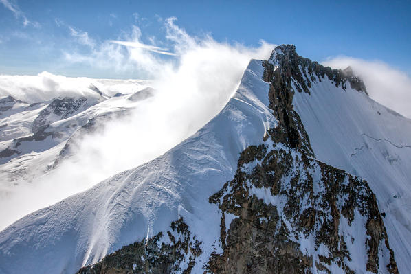 The fog is trying to hide Pizzo Bernina, Engadine Switzerland Europe
