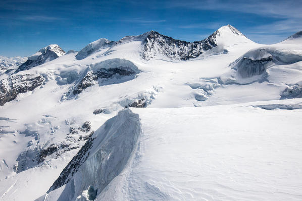Aerial shot of the glaciers of the Bernina with the famous peaks of Belleviste and Piz Palu, Switzerland Europe