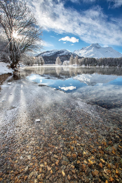 Ice covering the surface of Lake Sils Engadine, Switzerland Europe