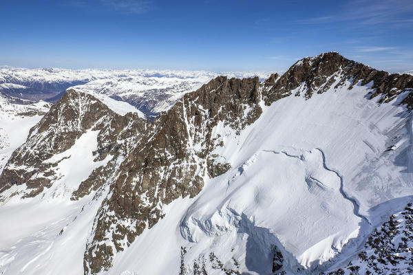 Aerial view of Piz Bernina and its glacier with a huge serac in Engadine, Switzerland Europe