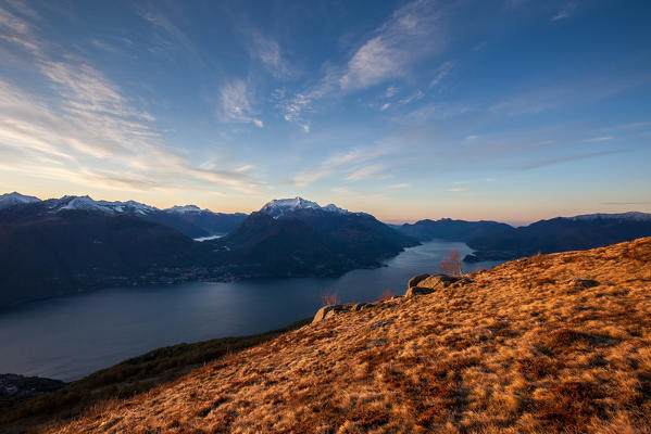 Grass on the ridges over Como Lake at dawn. High Lario, Lombardy, Italy Europe