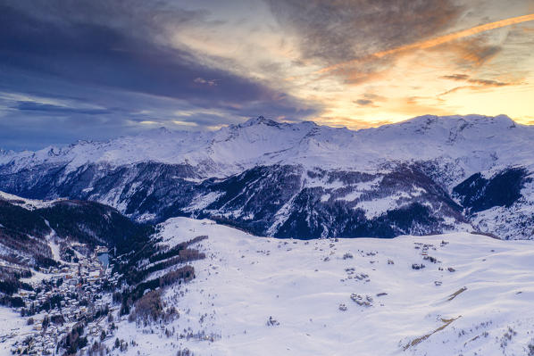 Aerial view of Madesimo and Andossi during a winter sunset, Valchiavenna, Valtellina, Lombardy, Italy