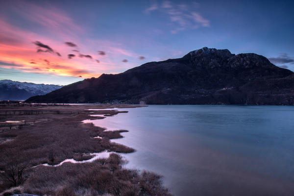 Sunset in the reserve of Pian di Spagna with the Berlinghera mount in the background, Valchiavenna, Lombardy Italy Europe