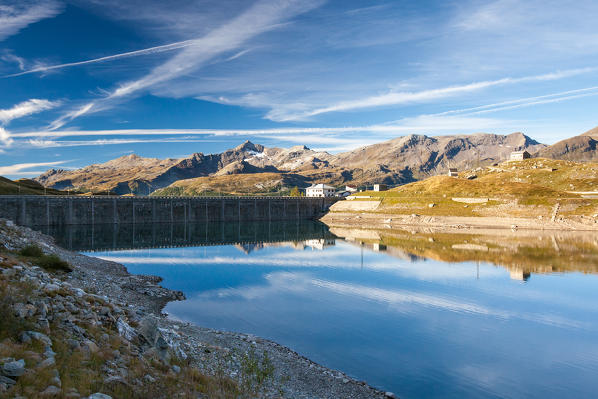 Clouds reflected in the Montespluga dam, Valchiavenna, Valtellina Lombardy Italy Europe
