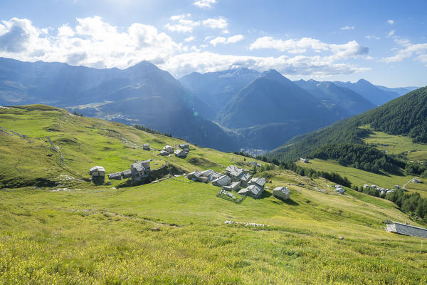 Stone huts and pastures of Toiana along the trail to Pian dei Cavalli, Vallespluga, Valchiavenna, Valtellina, Lombardy, Italy