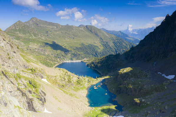 Aerial view of pristine Zancone lake and dam of Trona in summer, Orobie Alps, Valgerola, Valtellina, Lombardy, Italy