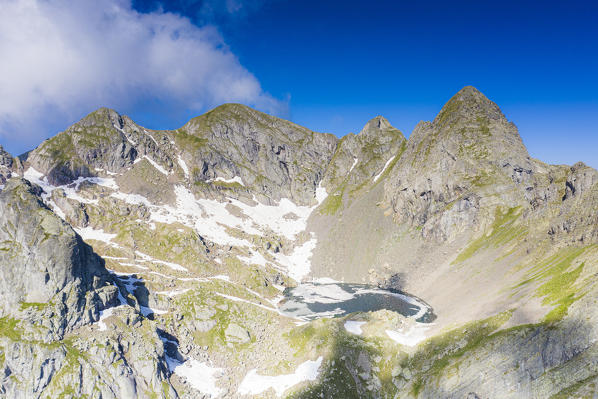 Aerial view of Lago Rotondo lake and majestic rocks of mountain peaks, Orobie Alps, Valgerola, Valtellina, Lombardy, Italy