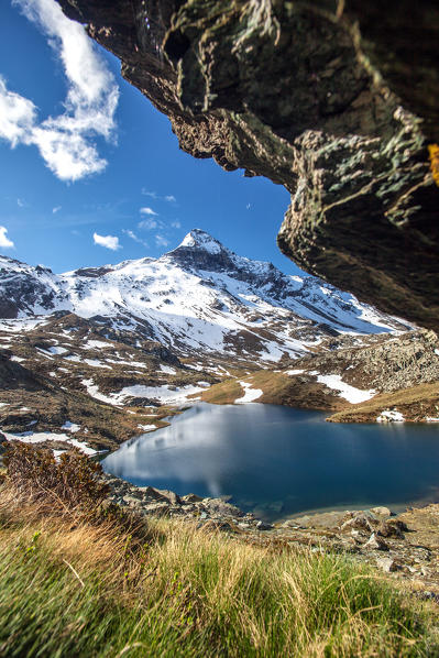 Overlooking the lake of Campagneda with the Pizzo Scalino still covered in snow in the background, Valmalenco, Valtellina Lombardy Italy Europe 