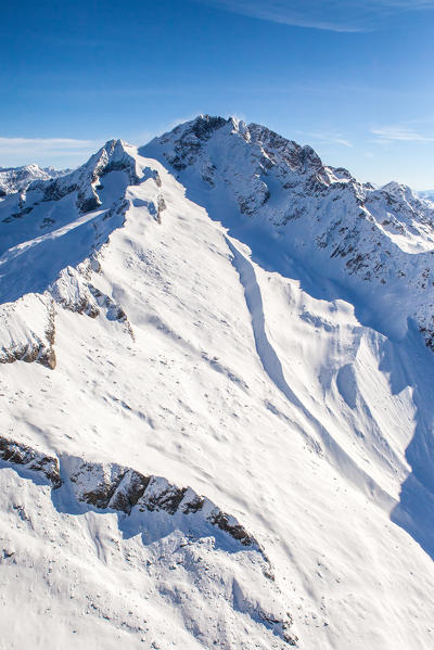 Aerial view of Monte Disgrazia in winter with the moraine created by the Predarossa glacier. Valmasino, Valtellina Lombardy, Italy Europe