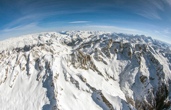 Wide angle shot of the peaks of Val Masino in winter. Val Masino, Valtellina Lombardy, Italy. Europe