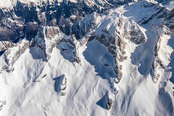 Aerial view of Pizzo Badile and Cengalo in winter, Valmasino. Valtellina Lombardy Italy Europe