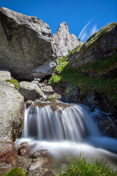 Little waterfall of the creek at the feet of Picco Luigi Amedeo. Valmasino, Valtellina Lombardy Italy Europe
