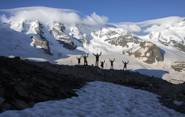 Photographers in silhouette posing for a picture in front of Bellaviste and Pizzo Palu, from which borns Vedret Pers.
Diavolezza Refuge,Engadine,Canton of Graubunden, Switzerland Europe