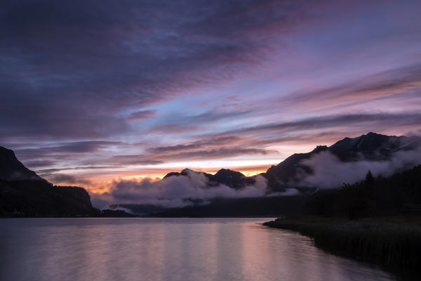 Colorful dawn at Lake Sils. Maloja Engadine Canton of Graubunden Switzerland Europe
