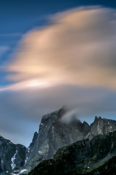 Clouds over Pizzo Badile at dawn. Bondo.Val Bregaglia,Canton of Grisons Switzerland Europe