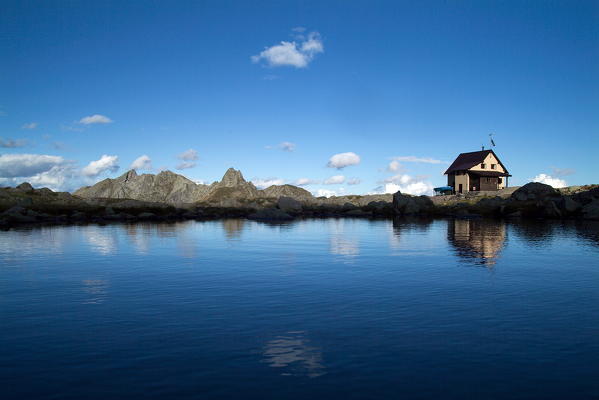 The Benigni Refuge reflected in Lake Piazzotti. Val Gerola,
Valtellina Lombardy, Italy Europe