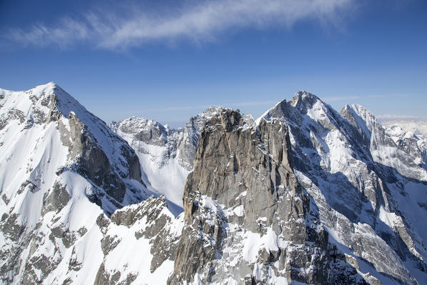 Aerial view of the granite peaks between Val Masino and Val Bondasca in winter with Pizzo Cengalo secondary. Val Bondasca, Val Bregaglia, Canton of Grisons, Switzerland Europe