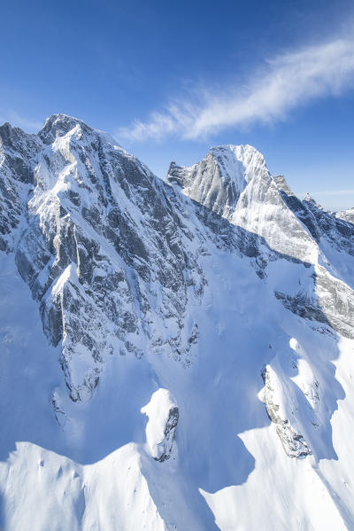 Aerial view of Pizzo Cengalo and Pizzo Badile covered in snow. Val Bondasca, Bregaglia Valley, Canton of Grisons, Switzerland Europe