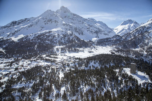 Aerial view of Belvedere tower with the houses of Maloja Pass covered in snow. Maloja Pass, Engadine, Canton of Grisons Switzerland Europe