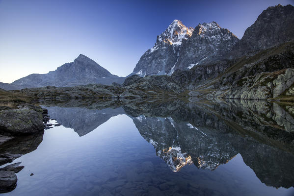 Monviso reflected in Lake Superior at dawn. Cozian Alps, Piedmont, Italy. Europe