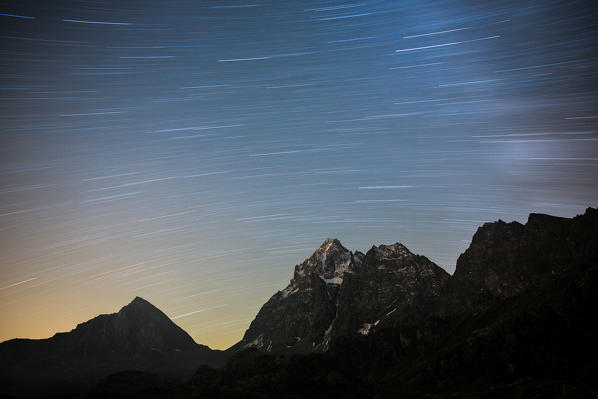 Startrail over the top of Monviso. Lake Superior, Cozian Alps, Piedmont, Italy Europe