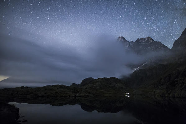 Cloud covering the top of Monviso in a night at Lake Superior. Lake Superior, Cozian Alps, Piedmont, Italy Europe