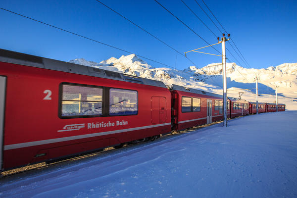 Typical carriages of the red train of Bernina. Engadine, Canton of Grisons, Switzerland Europe