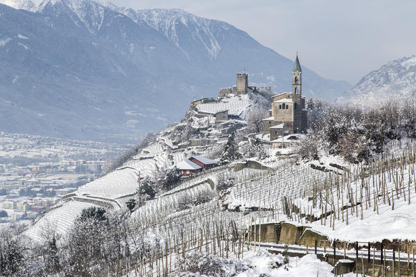 Church of San Atonio Abate and Castel Grumello in winter. Montagna, Valtellina, Lombardy, Italy Europe