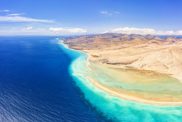 Aerial view of sand beach of Costa Calma in between desert and ocean, Jandia Nature Park, Fuerteventura, Canary Islands, Spain
