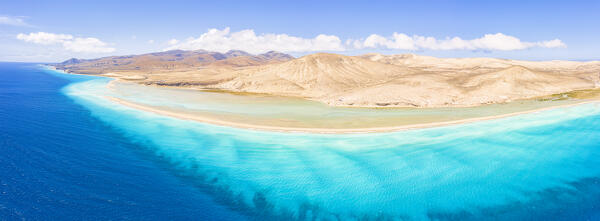 Aerial view of turquoise sea framing the sand beach of Costa Calma, Jandia Nature Park, Fuerteventura, Canary Islands, Spain