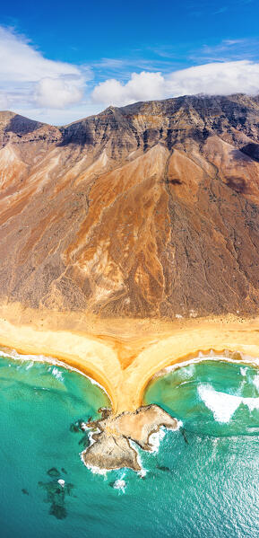 Majestic mountain Pico De La Zarza and El Islote in the crystal sea, Cofete Beach, Jandia, Fuerteventura, Canary Islands, Spain