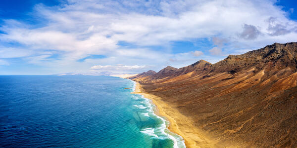 Aerial view of Cofete Beach and mountains by the ocean, Jandia Nature Park, Fuerteventura, Canary Islands, Spain