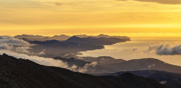 Burning sky at dawn over Jandia Peninsula and ocean from Pico de la Zarza mountain peak, Fuerteventura, Canary Islands, Spain