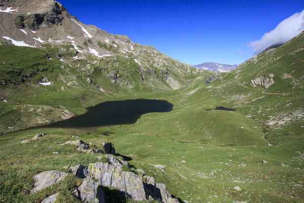 Lake Baldiscio surrounded by green pastures. Baldiscio Pass Campodolcino, Vallespluga, Valchiavenna, Lombardy, Italy Europe