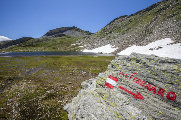 Signal with red paint at Pian dei Cavalli. Vallespluga, Valchiavenna, Lombardy, Italy Europe