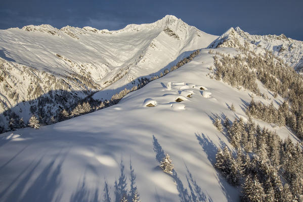 Aerial view of Alpe Scima at first light. Alpe Scima, Valchiavenna, Valtellina Lombardy Italy Europe