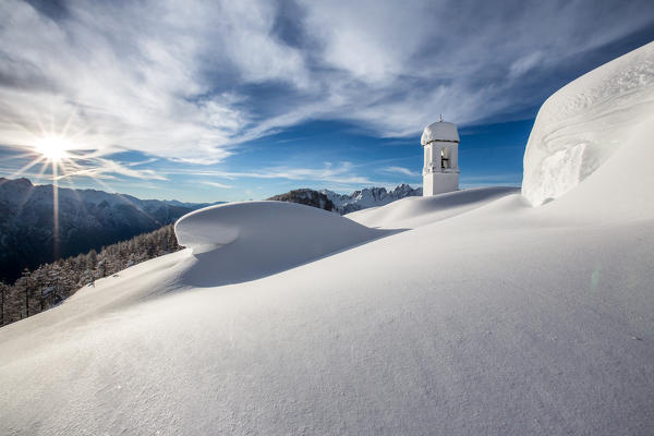 Sun shining over the Alpe Scima covered by metres of snow. Alpe Scima, Valchiavenna, Valtellina Lombardy Italy Europe