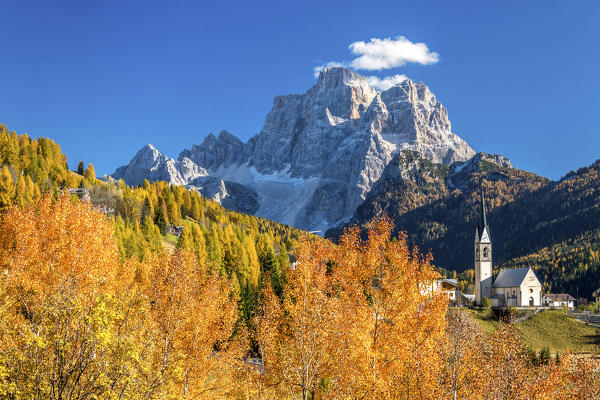 Autumn colors in Selva of Cadore with Mount Pelmo in the background. Dolomites. Cadore. Veneto. Italy. Europe