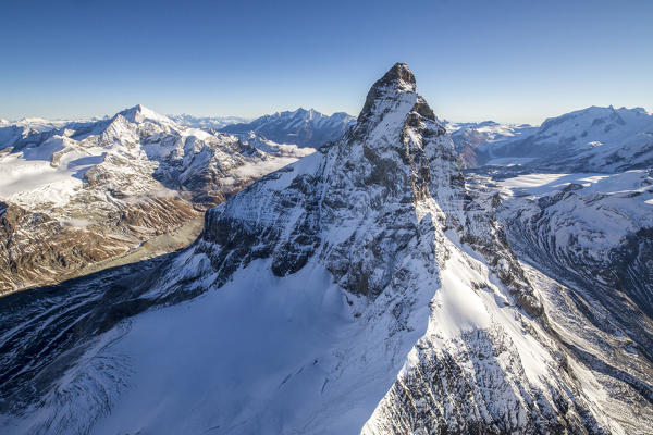 Aerial view of the Matterhorn divided between light and shadow. Zermatt. Switzerland. Europe