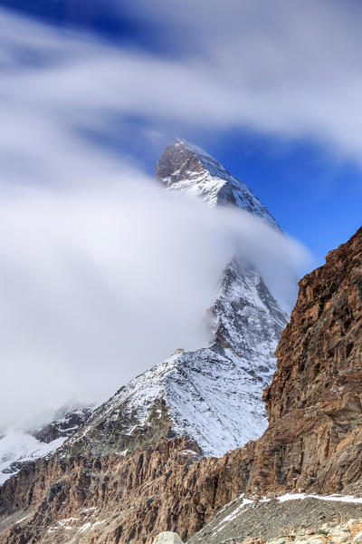 Hornli-hutte covered in the fog that hides the peak of the Matterhorn. Zermatt, Valais, Switzerland Europe