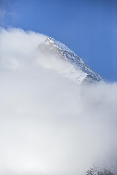 The peak of the Matterhorn covered in fog. Zermatt, Valais, Switzerland Europe