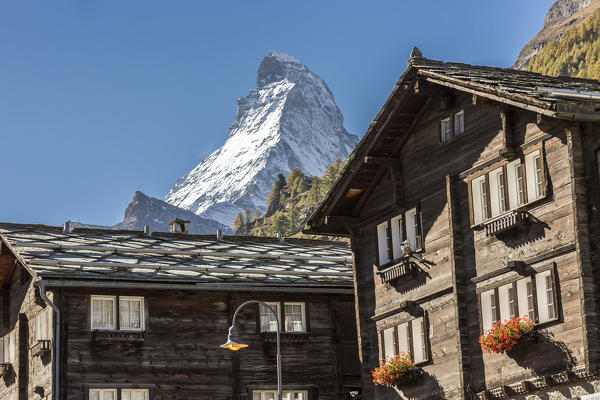 Traditional houses in the village of Zermatt with  Matterhorn in the background. Valais, Switzerland Europe