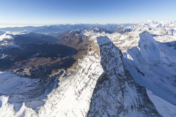 Aerial view of the snowy peak of Matterhorn with the alpine village of Cervinia in the background Zermatt canton of Valais Switzerland Europe