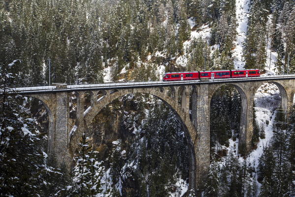 partially covered with snow Engadine. Canton of Graubuenden. Switzerland. Europe.