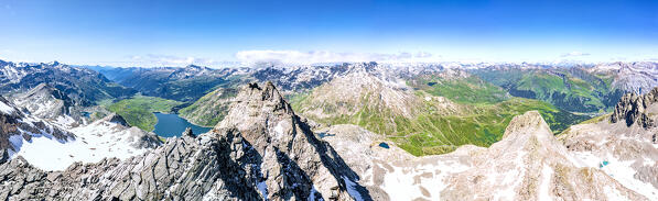 Aerial panoramic view of lake Montespluga, Pizzo Suretta peak and Splugen Pass, Madesimo, Valle Spluga, Valtellina, Lombardy, Italy